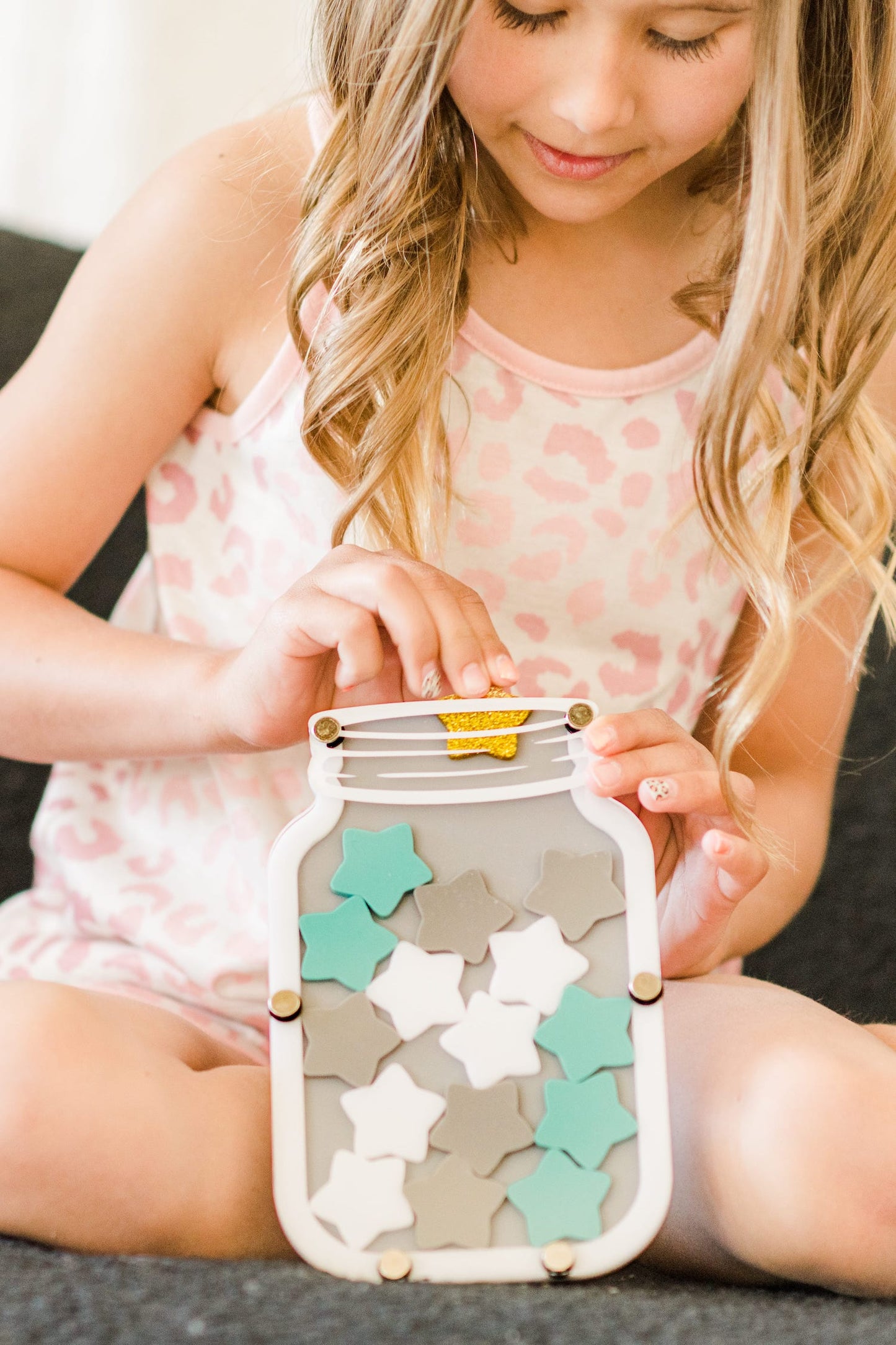 Colorful star jar reward system for kids, children's hands holding stars, star jar stars, replacement stars, blue star, gold star, pink star, girls holding star jar, potty training rewards, chore rewards